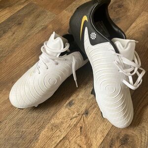 White and Black Soccer Cleats with Yellow Accent